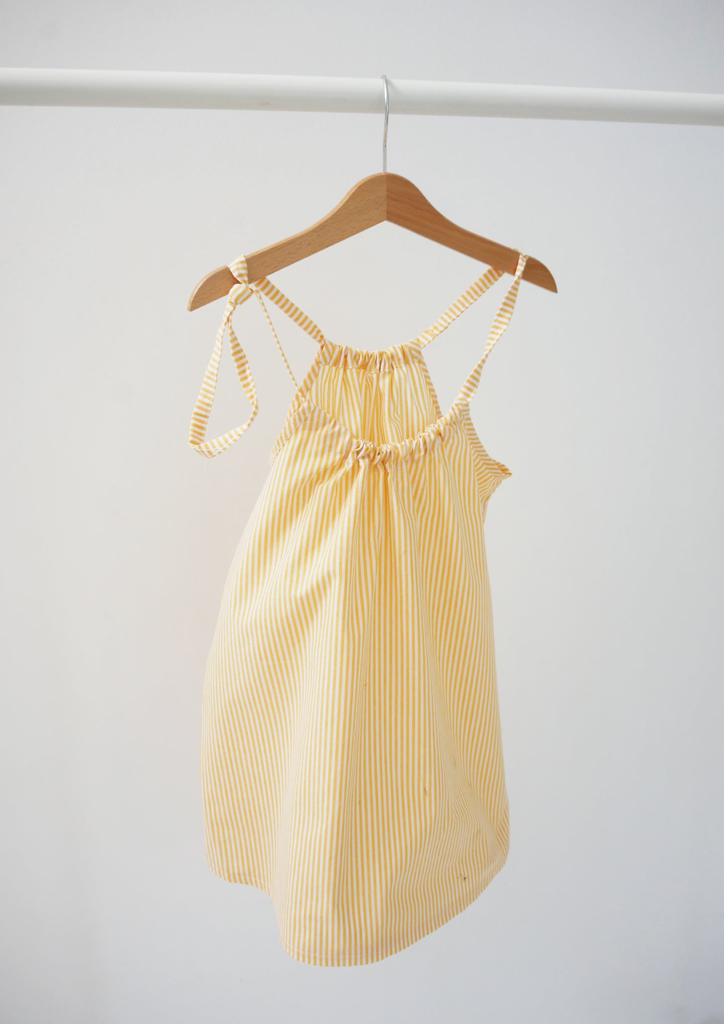 skirt/dress on adjustable straps with white and yellow stripes