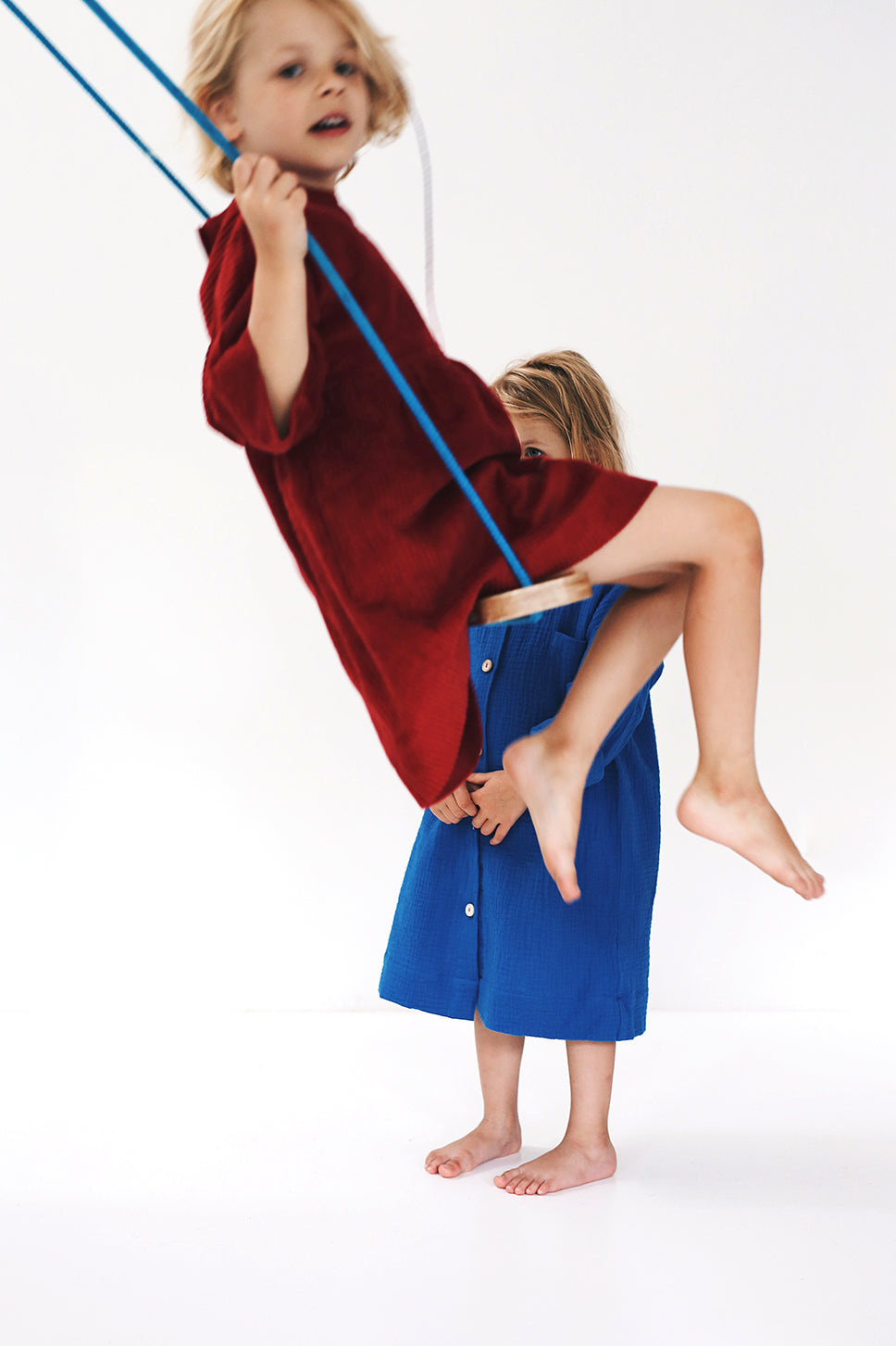 dark red dress from corduroy with wooden buttons on the back- cloth took part in photo session