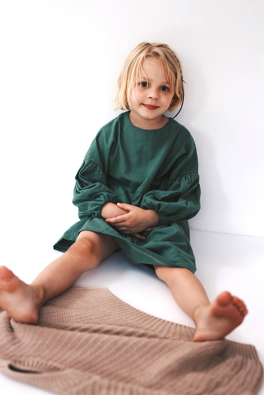 green dress with long puffed sleeves