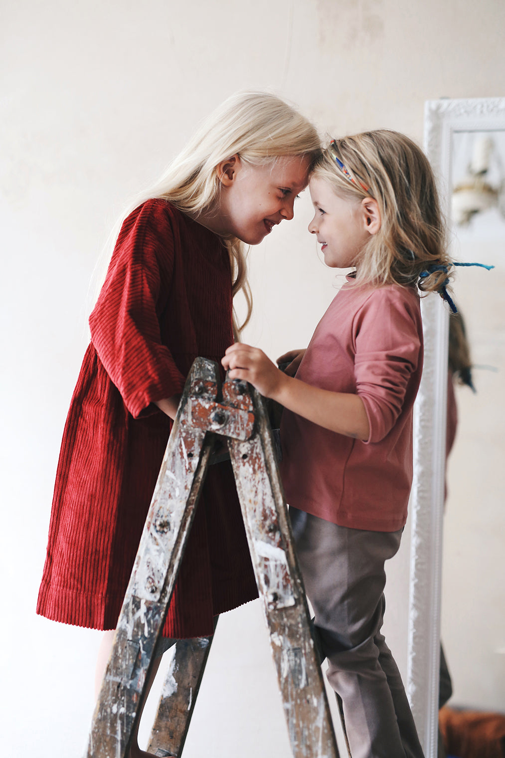 dark red dress from corduroy with wooden buttons on the back- cloth took part in photo session