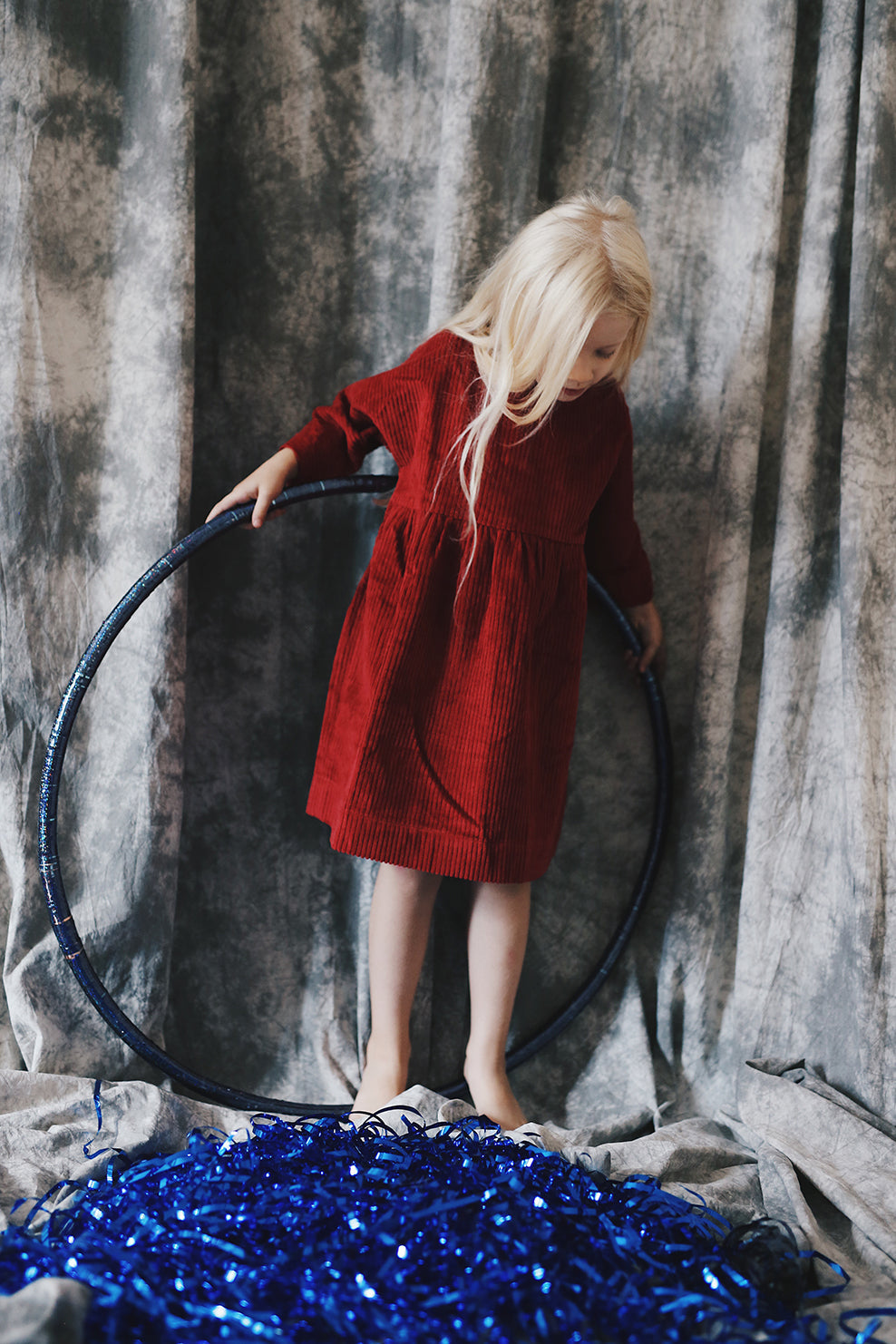 dark red dress from corduroy with wooden buttons on the back- cloth took part in photo session