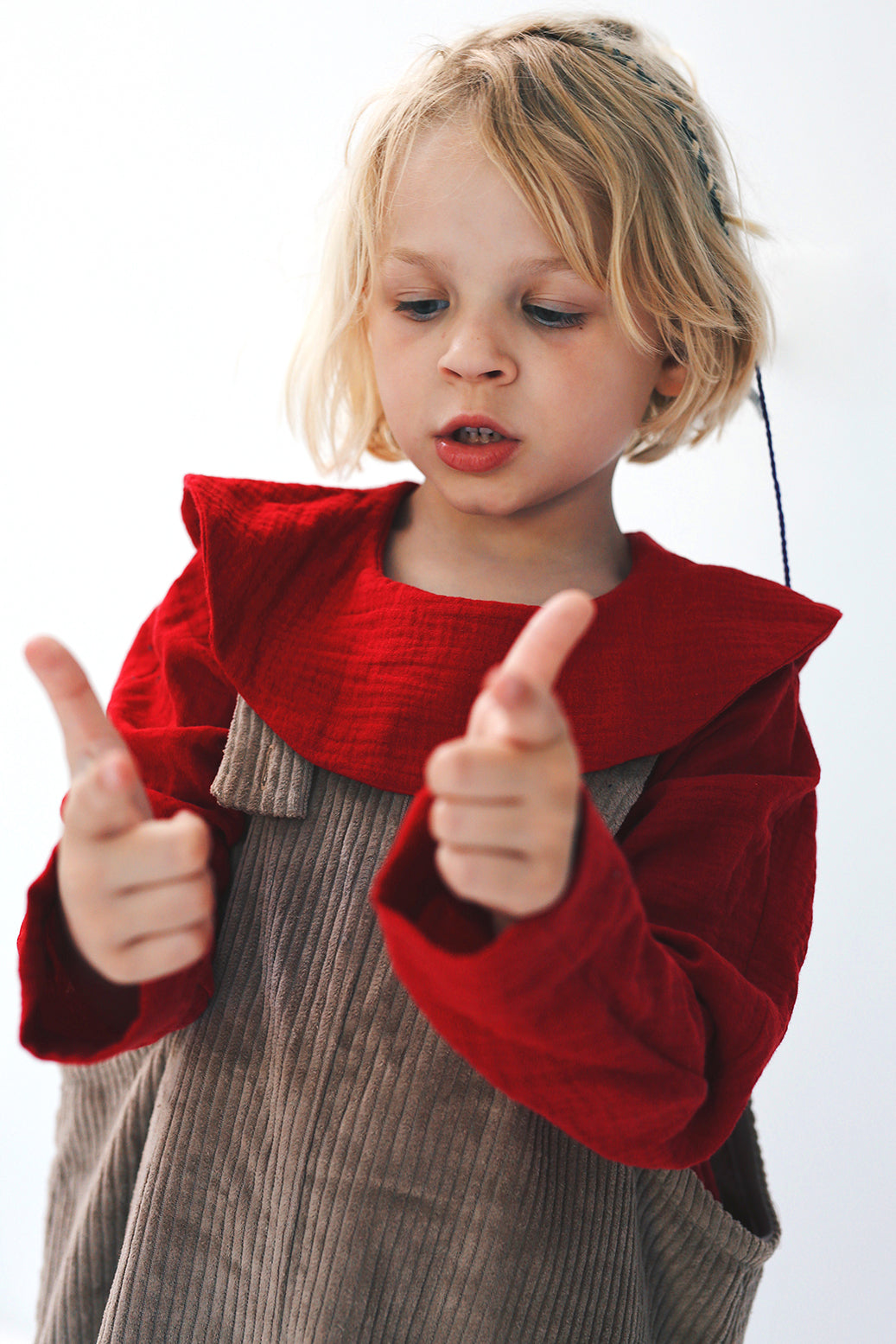 dark red dungarees with wide legs- cloth took part in photo session