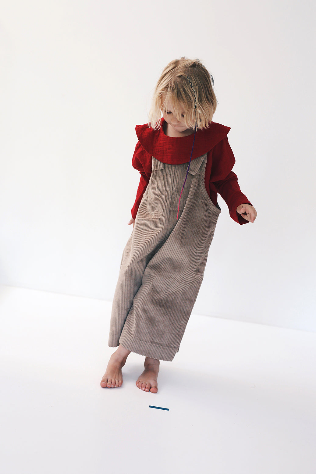 dark red dungarees with wide legs- cloth took part in photo session