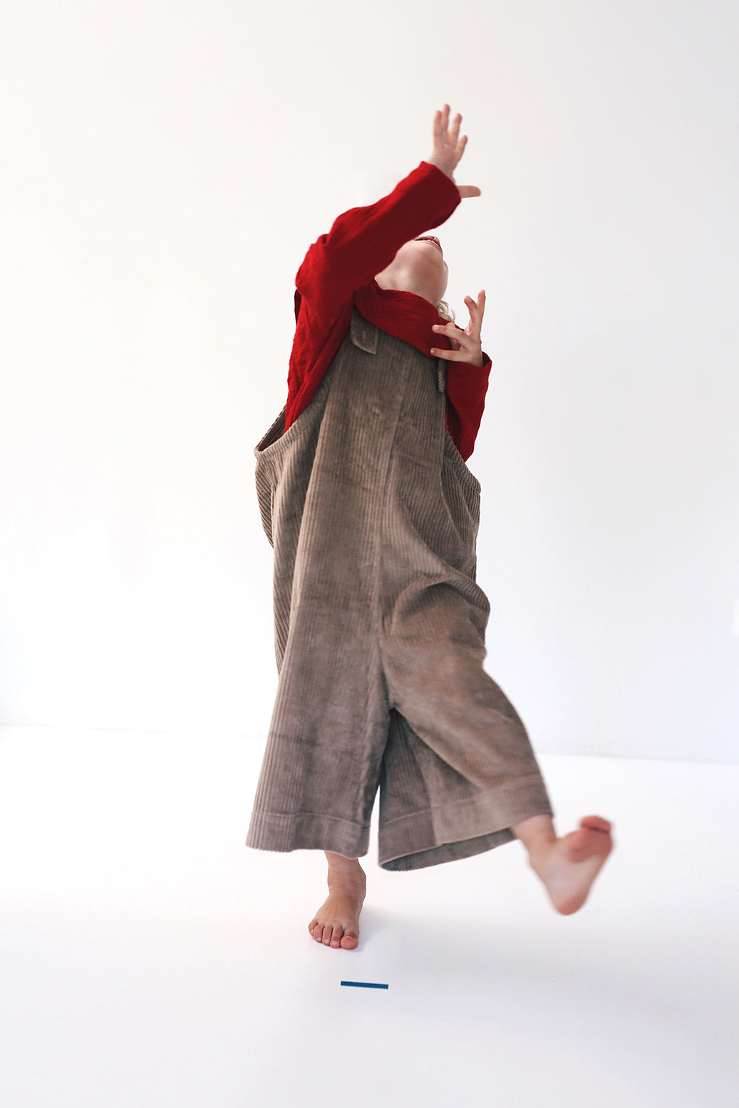 dark red dungarees with wide legs- cloth took part in photo session