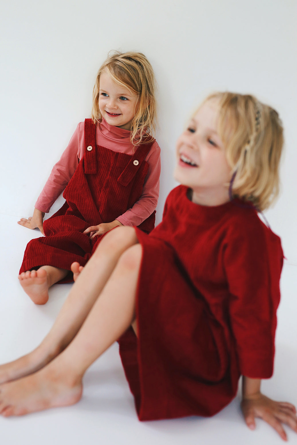 dark red dress from corduroy with wooden buttons on the back- cloth took part in photo session