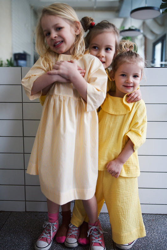 dress with buttons on the back with white and yellow stripes