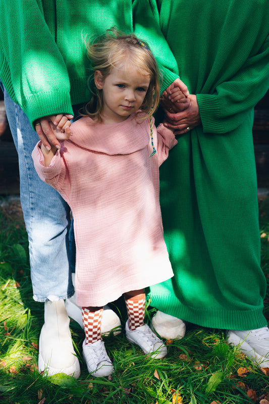 pink dress with long sleeves with big, round collar