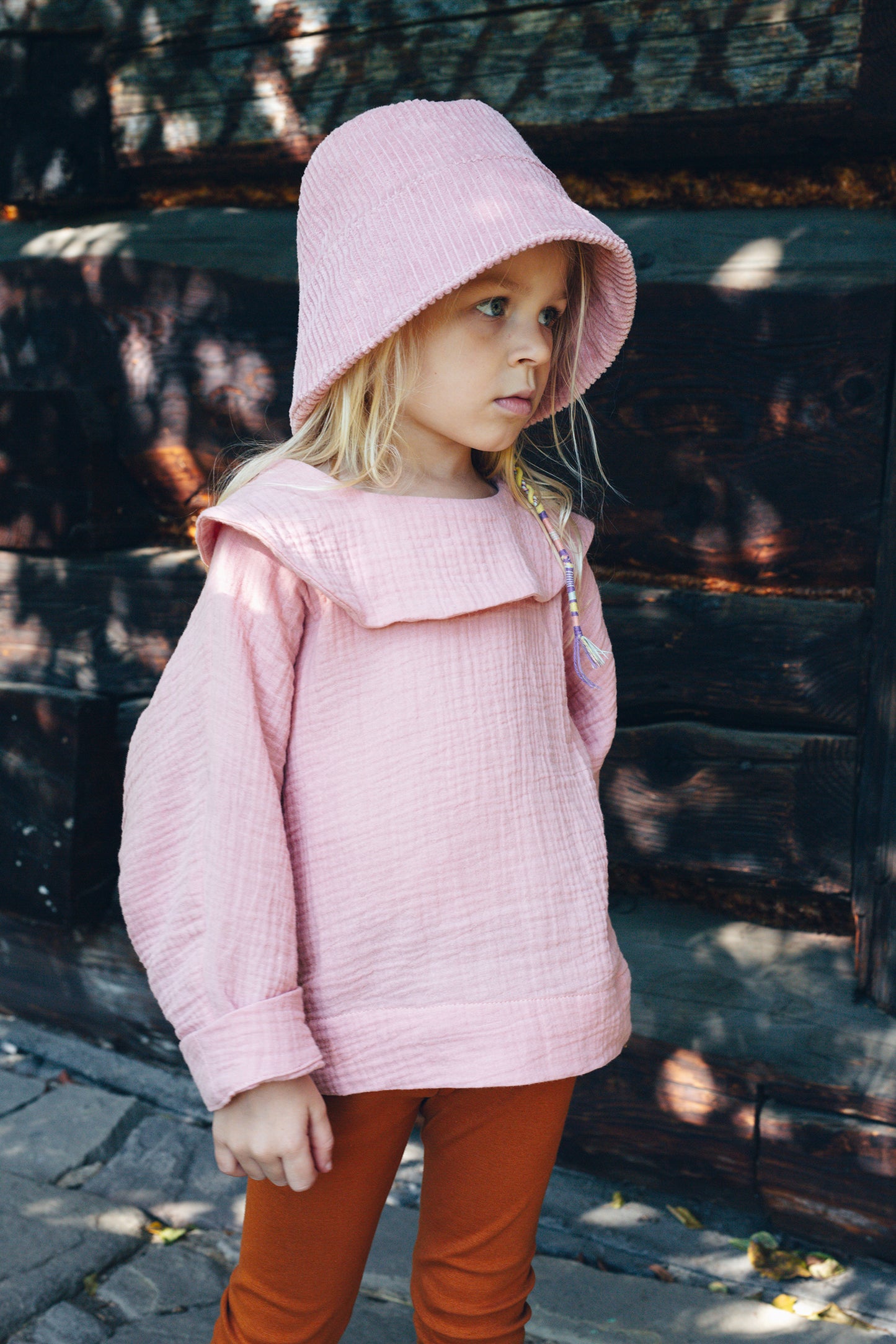 pink shirt with long sleeves with big round collar