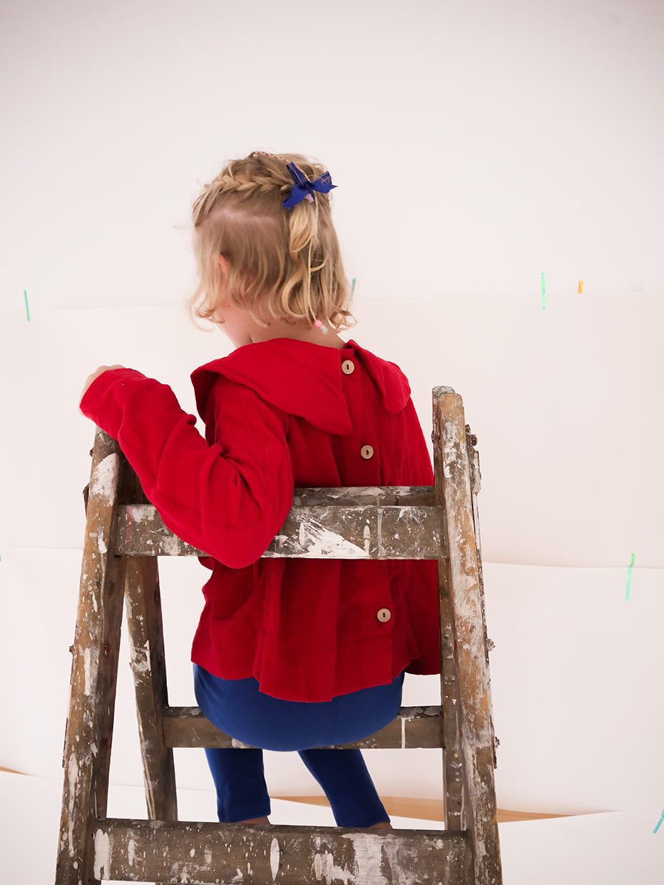 dark red shirt with big, round collar with long sleeves- cloth took part in photo session