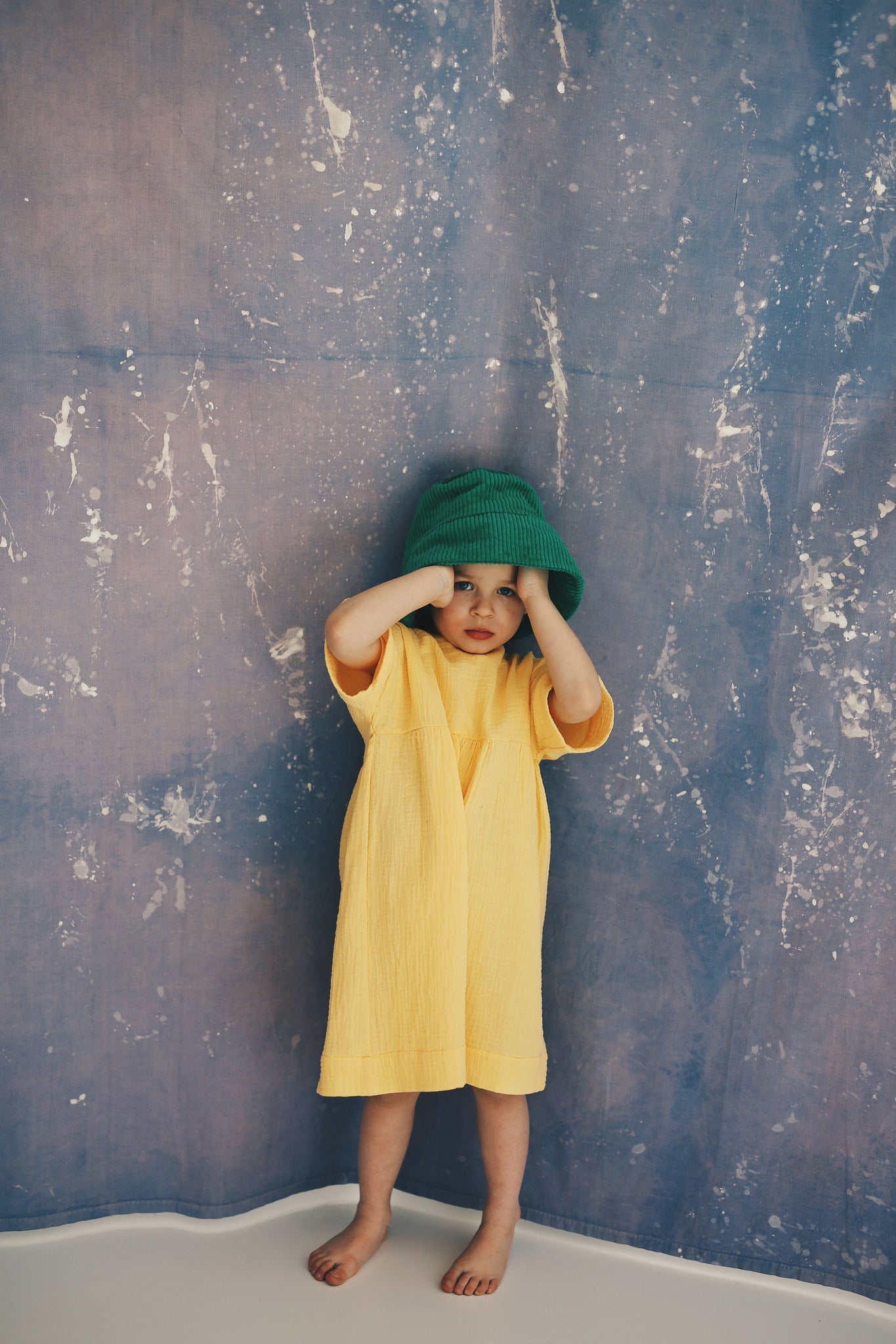 yellow dress with buttons on the back