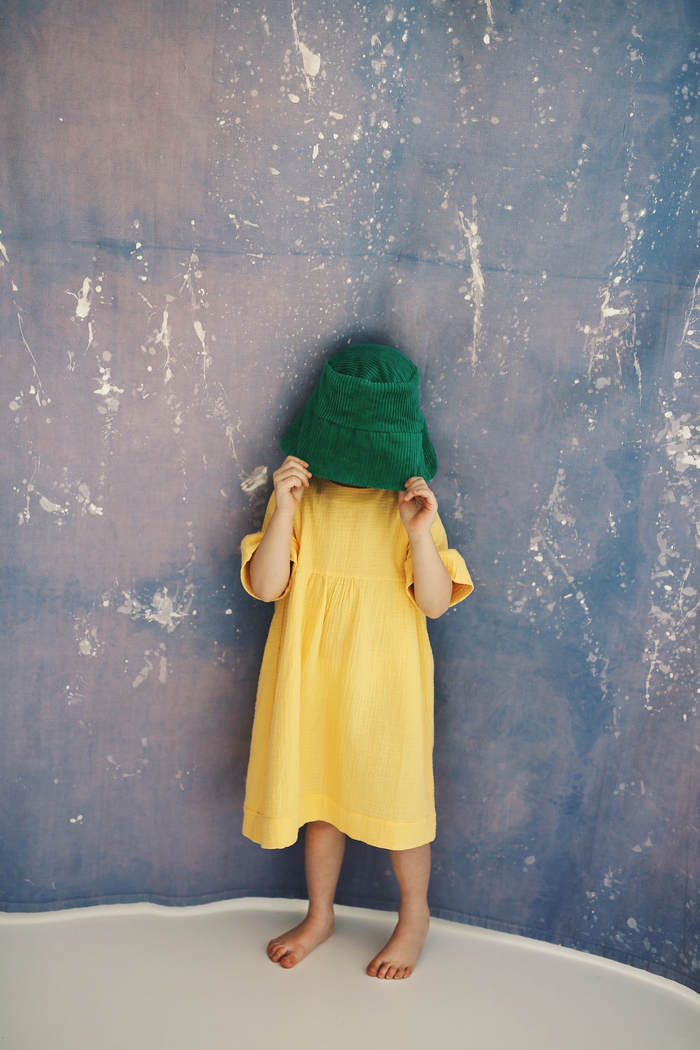 yellow dress with buttons on the back