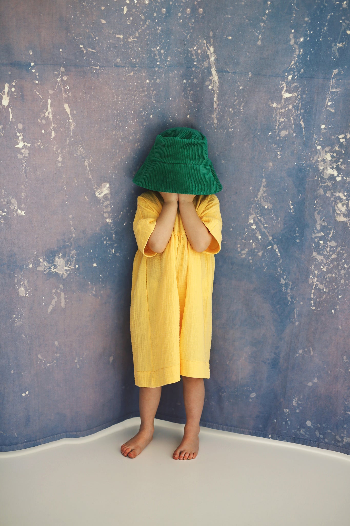 yellow dress with buttons on the back