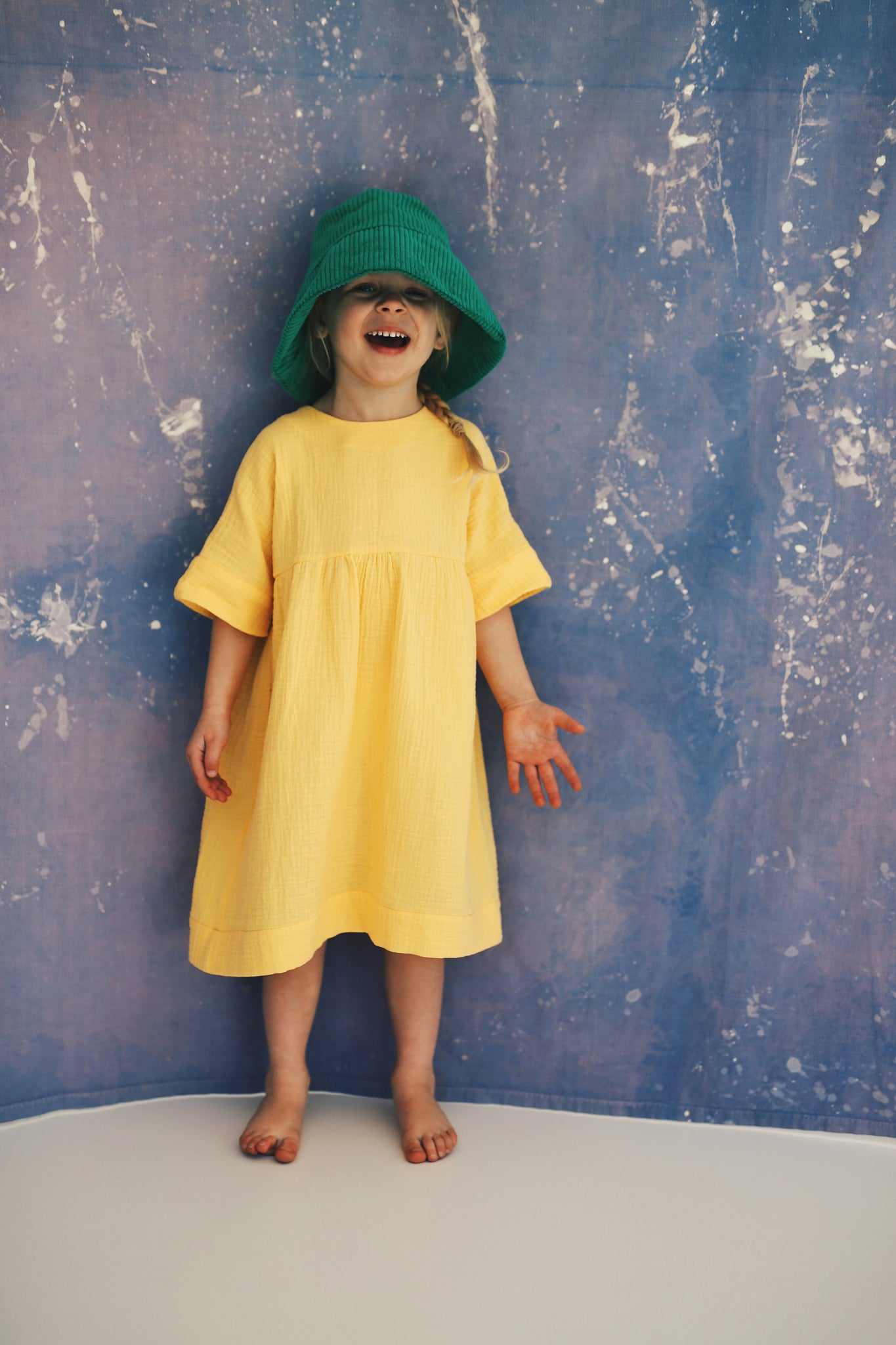 yellow dress with buttons on the back