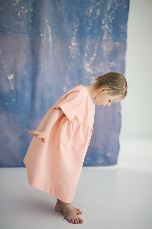 pink dress with buttons on the back