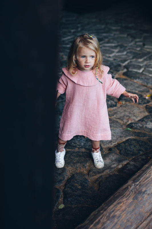 pink dress with long sleeves with big, round collar