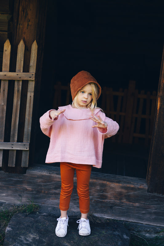 pink shirt with long sleeves with big round collar