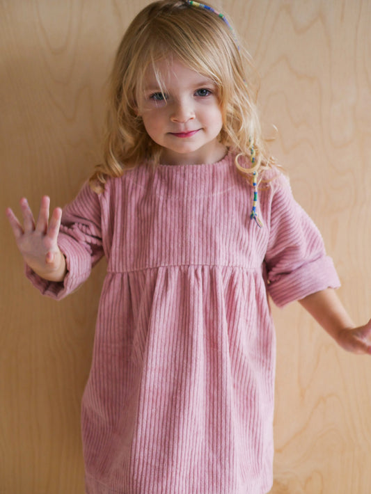 pink dress from corduroy with wooden buttons on the back