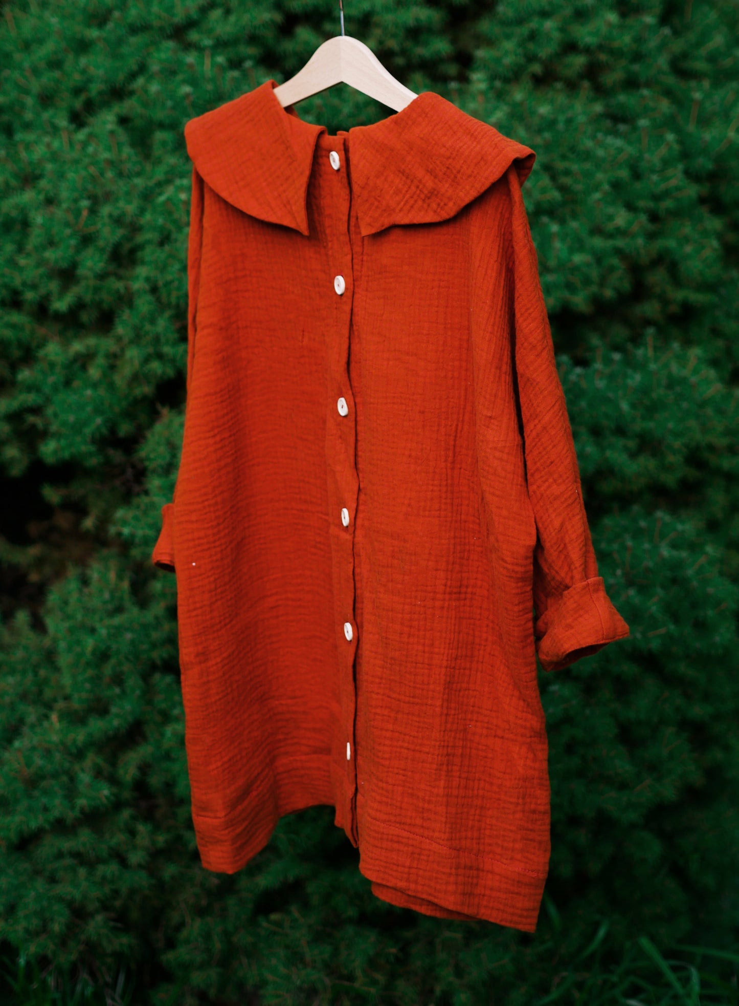 caramel dress with long sleeves with big, round collar